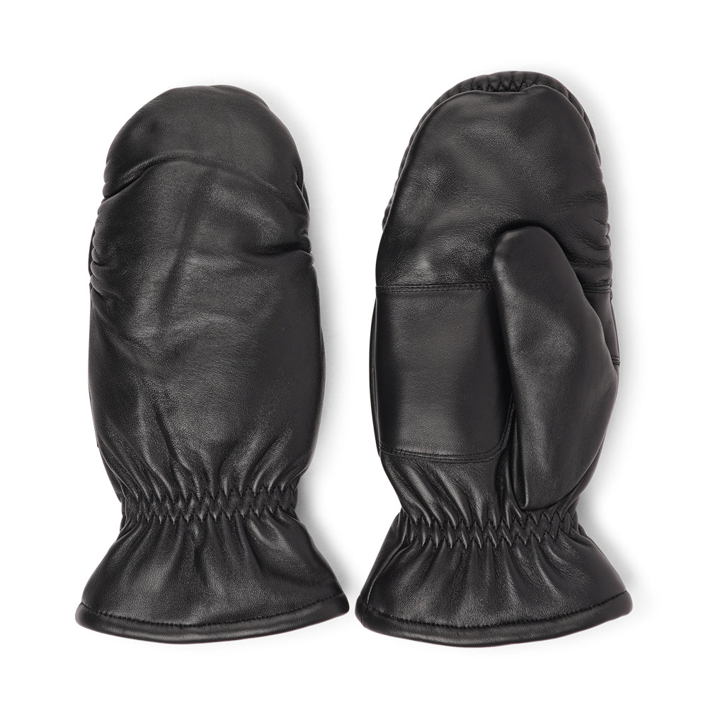 The Amalfi mittens are crafted from soft, premium leather and lined with cozy terry fleece for ultimate warmth and comfort. Designed for a sleek, timeless look, they feature an elastic wrist for a secure fit. Perfect for cold days, these luxurious mittens combine style and practicality with ease.