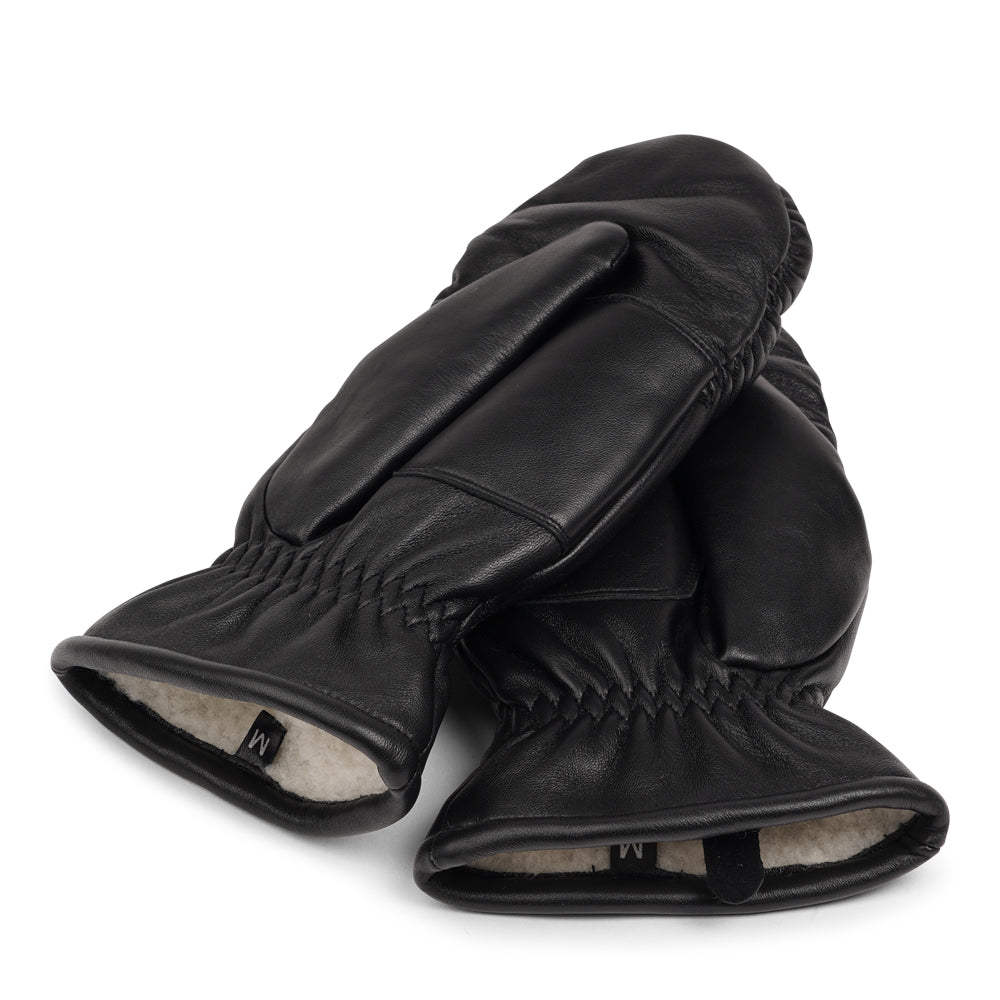 The Amalfi mittens are crafted from soft, premium leather and lined with cozy terry fleece for ultimate warmth and comfort. Designed for a sleek, timeless look, they feature an elastic wrist for a secure fit. Perfect for cold days, these luxurious mittens combine style and practicality with ease.