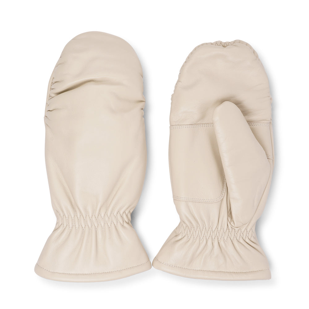 The Amalfi mittens are crafted from soft, premium leather and lined with cozy terry fleece for ultimate warmth and comfort. Designed for a sleek, timeless look, they feature an elastic wrist for a secure fit. Perfect for cold days, these luxurious mittens combine style and practicality with ease.