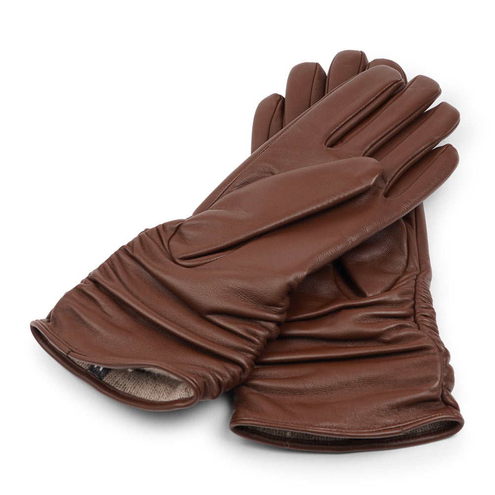 Lovelies Studio - Denmark - The Asti gloves are crafted from supple leather and lined with luxurious cashmere, offering both elegance and warmth.

Designed with a feminine touch, these gloves provide a sleek and sophisticated look while ensuring superior comfort during colder days. Perfect for adding a touch of refinement to any winter outfit.