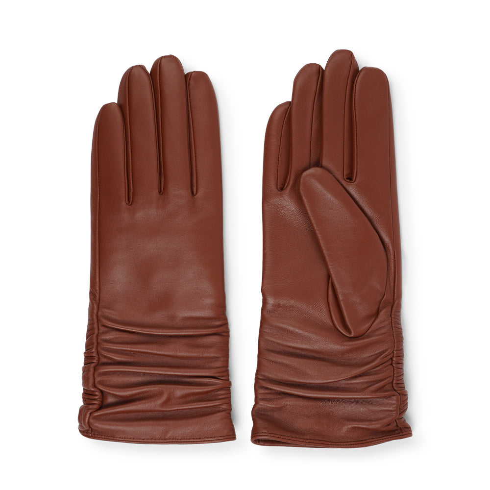 Lovelies Studio - Denmark - The Asti gloves are crafted from supple leather and lined with luxurious cashmere, offering both elegance and warmth.

Designed with a feminine touch, these gloves provide a sleek and sophisticated look while ensuring superior comfort during colder days. Perfect for adding a touch of refinement to any winter outfit.