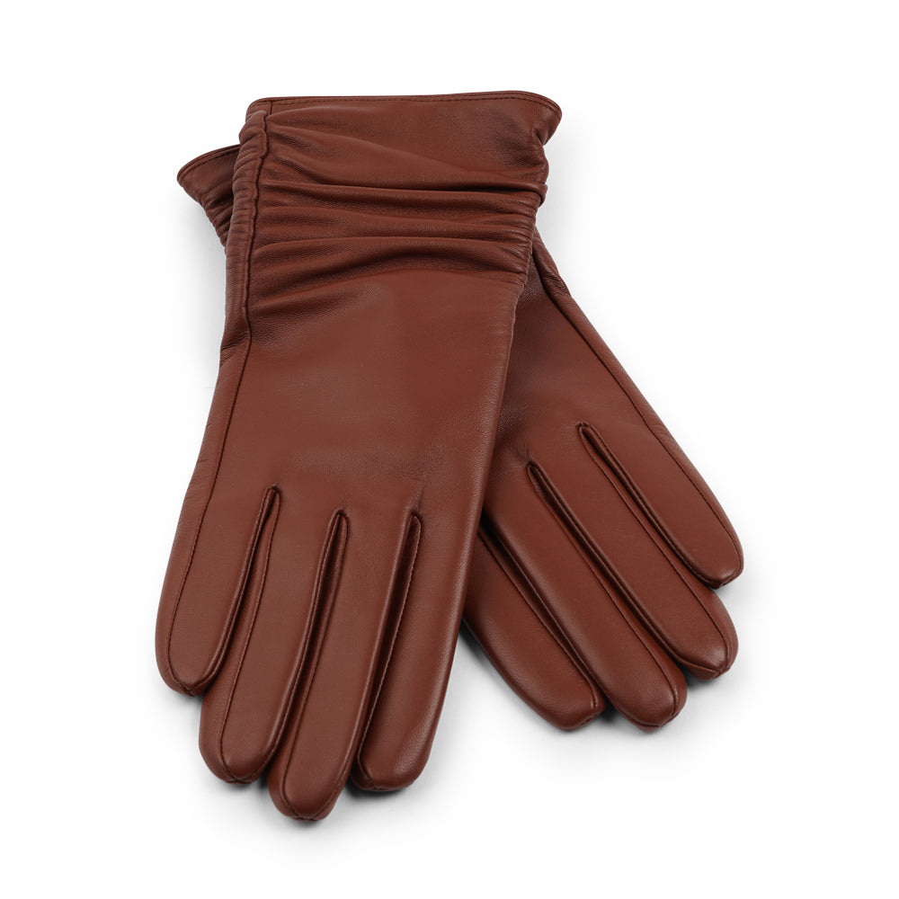 Lovelies Studio - Denmark - The Asti gloves are crafted from supple leather and lined with luxurious cashmere, offering both elegance and warmth.

Designed with a feminine touch, these gloves provide a sleek and sophisticated look while ensuring superior comfort during colder days. Perfect for adding a touch of refinement to any winter outfit.