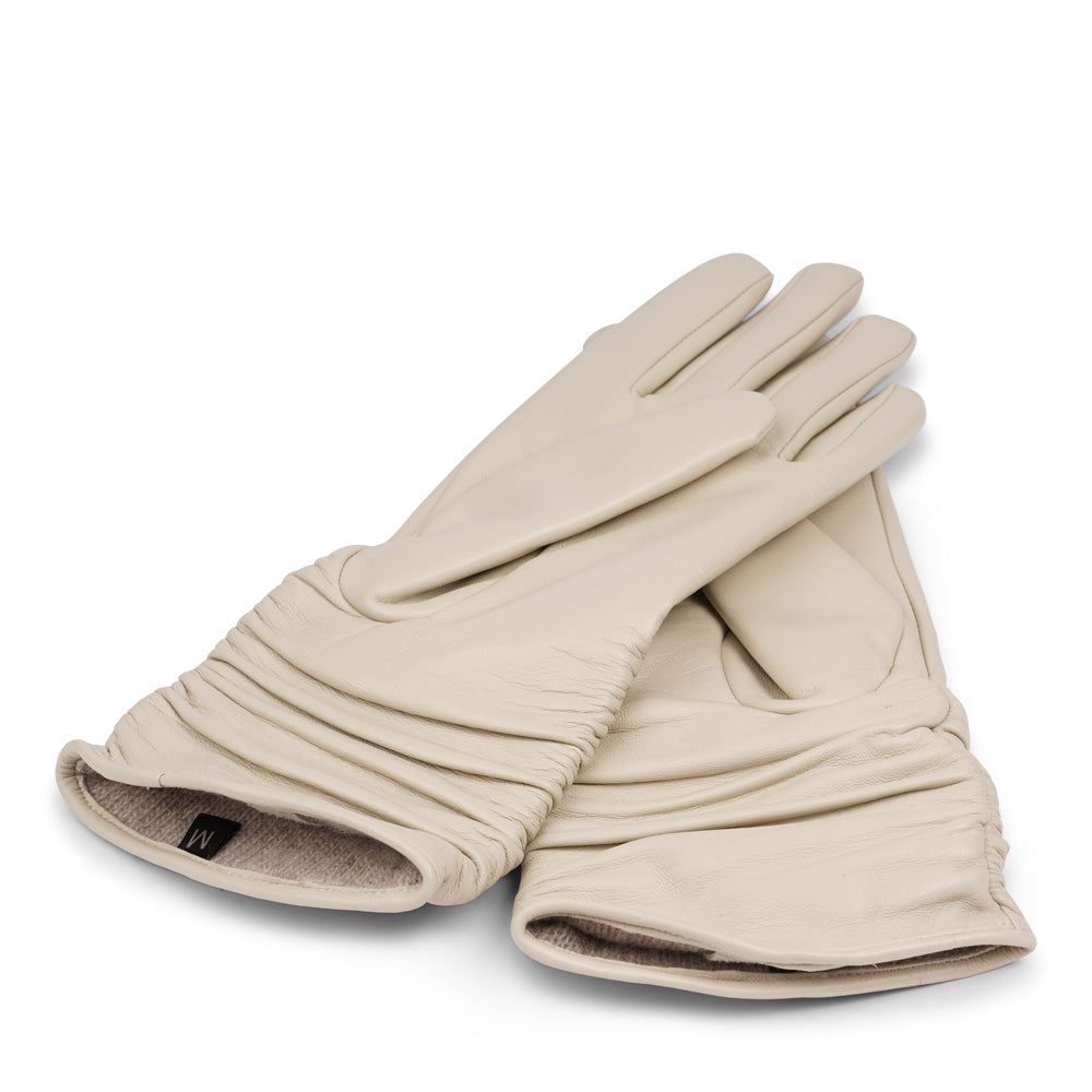 Lovelies Studio - Denmark - The Asti gloves are crafted from supple leather and lined with luxurious cashmere, offering both elegance and warmth.

Designed with a feminine touch, these gloves provide a sleek and sophisticated look while ensuring superior comfort during colder days. Perfect for adding a touch of refinement to any winter outfit.