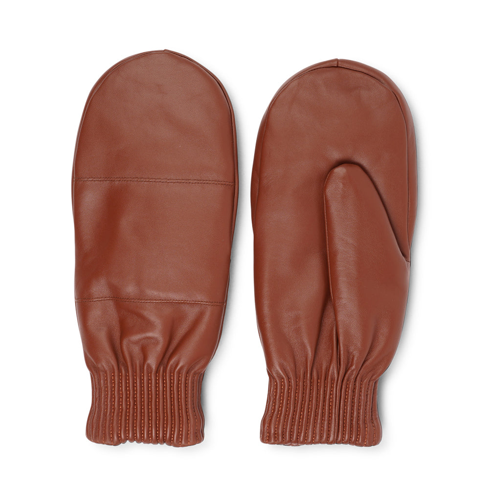 The Bergamo mittens are crafted from soft, premium leather and lined with cozy terry fleece for ultimate warmth and comfort.

Designed for a sleek, timeless look, they feature an elastic wrist for a secure fit. Perfect for cold days, these luxurious mittens combine style and practicality with ease.