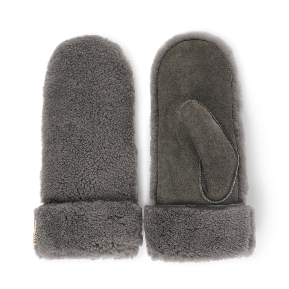 The cozy&nbsp;Colon mittens are made of 100% Australian double faced shearling.


The palm&nbsp;is soft sheep skin and the beautiful upper, cuff and the lining are curly sheep fur. The thumb is made with only one side sawing for the best comfort and style.

Our&nbsp;Colon mittens are extra long which means that you can fold and wear them in 4 different ways.

with a larger and around 7 cm wide cuff
A shorter 4 cm cuff which gives the mittens a lightly different look.
A super short 1 cm cuff which gives you 