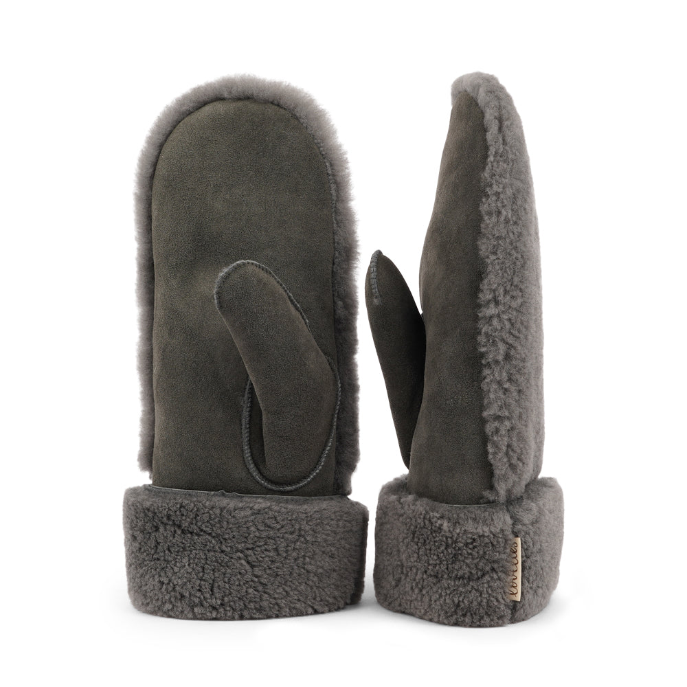 The cozy&nbsp;Colon mittens are made of 100% Australian double faced shearling.


The palm&nbsp;is soft sheep skin and the beautiful upper, cuff and the lining are curly sheep fur. The thumb is made with only one side sawing for the best comfort and style.

Our&nbsp;Colon mittens are extra long which means that you can fold and wear them in 4 different ways.

with a larger and around 7 cm wide cuff
A shorter 4 cm cuff which gives the mittens a lightly different look.
A super short 1 cm cuff which gives you 