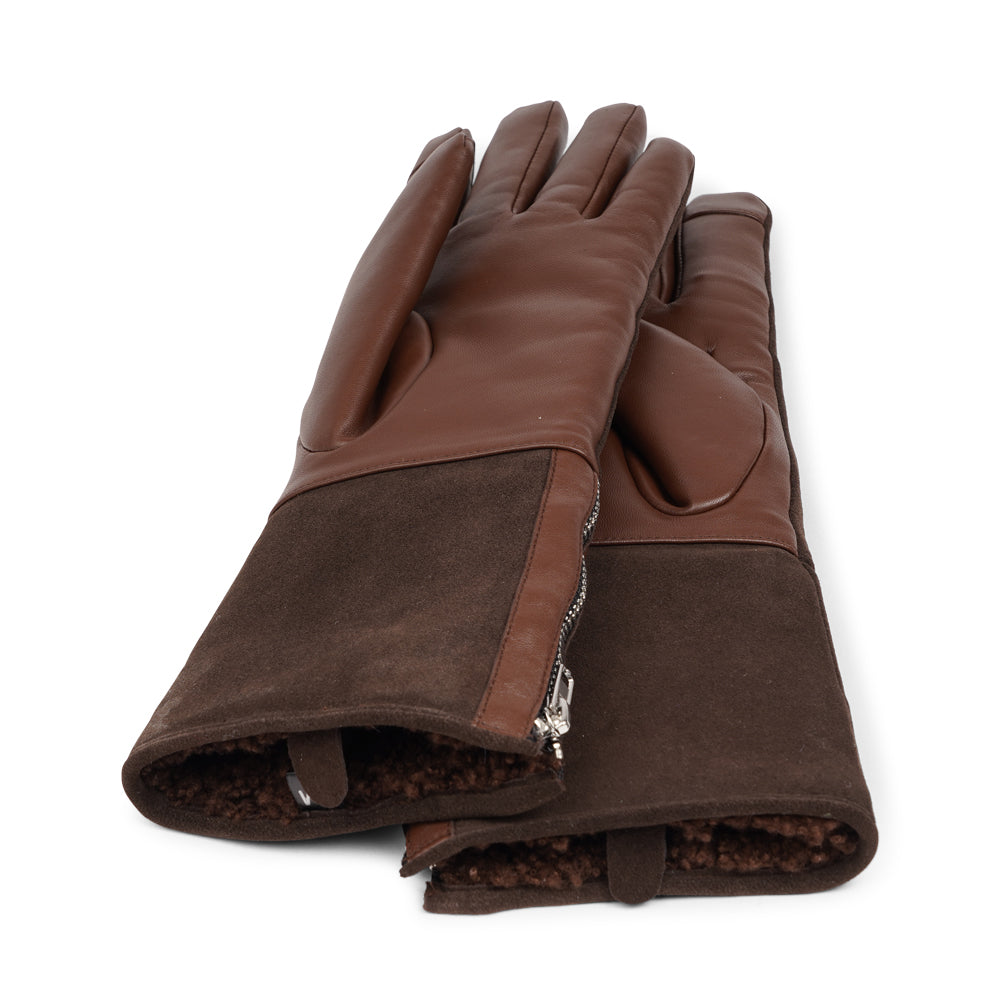 Lovelies Studio - The Cremona gloves combine elegance and warmth, crafted from soft leather with a chic zip detail for a modern touch. Lined with luxurious shearling, these gloves offer superior comfort and insulation.

Their feminine design and refined style make Cremona the perfect accessory for staying stylish in colder weather.