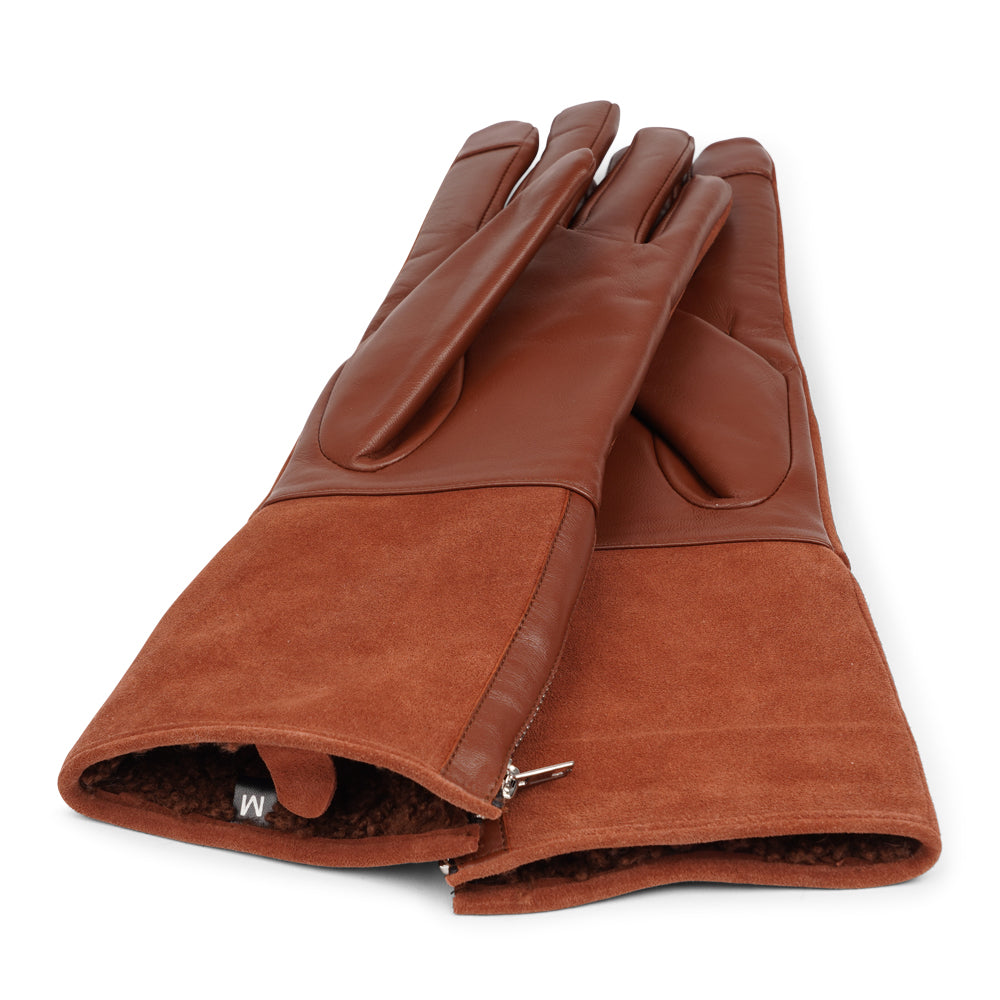 Lovelies Studio - The Cremona gloves combine elegance and warmth, crafted from soft leather with a chic zip detail for a modern touch. Lined with luxurious shearling, these gloves offer superior comfort and insulation.

Their feminine design and refined style make Cremona the perfect accessory for staying stylish in colder weather.