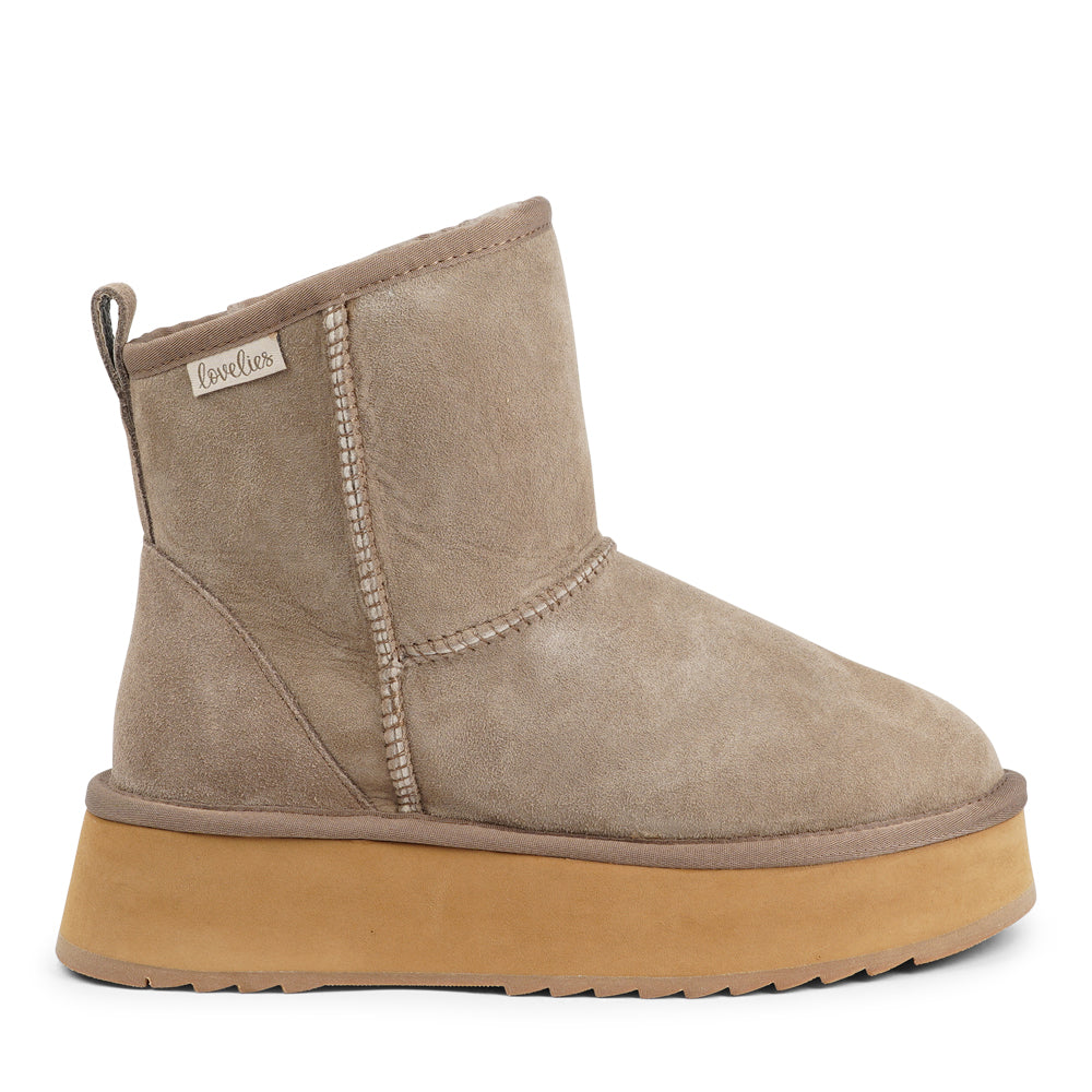 Designed for your ultimate comfort, these luxurious shearling boots are the perfect winter companions. Featuring soft, durable rubber soles, they ensure you can step through the colder months with confidence, keeping your feet well-protected from the elements.&nbsp;

Lovelies Studio - But Laveno offers more than just practicality—these boots blend warmth and style seamlessly, making them as fashionable as they are functional.