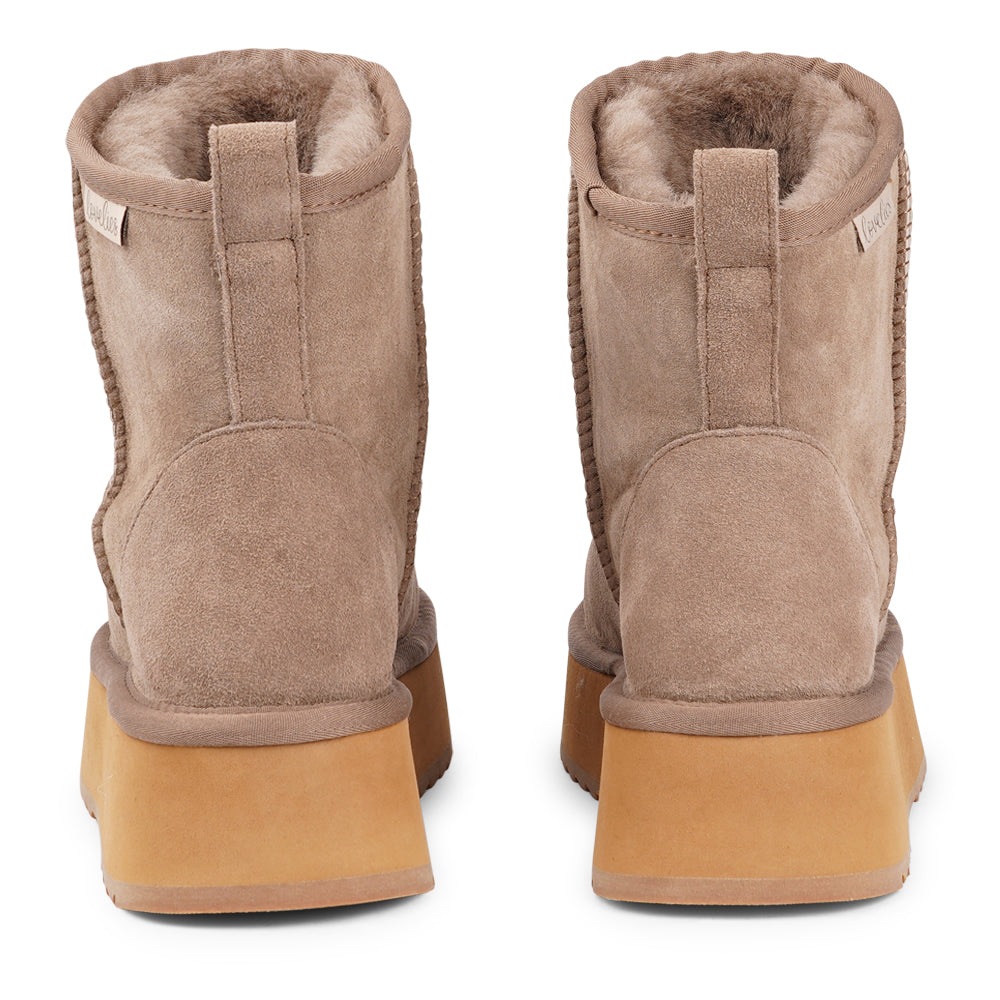 Designed for your ultimate comfort, these luxurious shearling boots are the perfect winter companions. Featuring soft, durable rubber soles, they ensure you can step through the colder months with confidence, keeping your feet well-protected from the elements.&nbsp;

Lovelies Studio - But Laveno offers more than just practicality—these boots blend warmth and style seamlessly, making them as fashionable as they are functional.