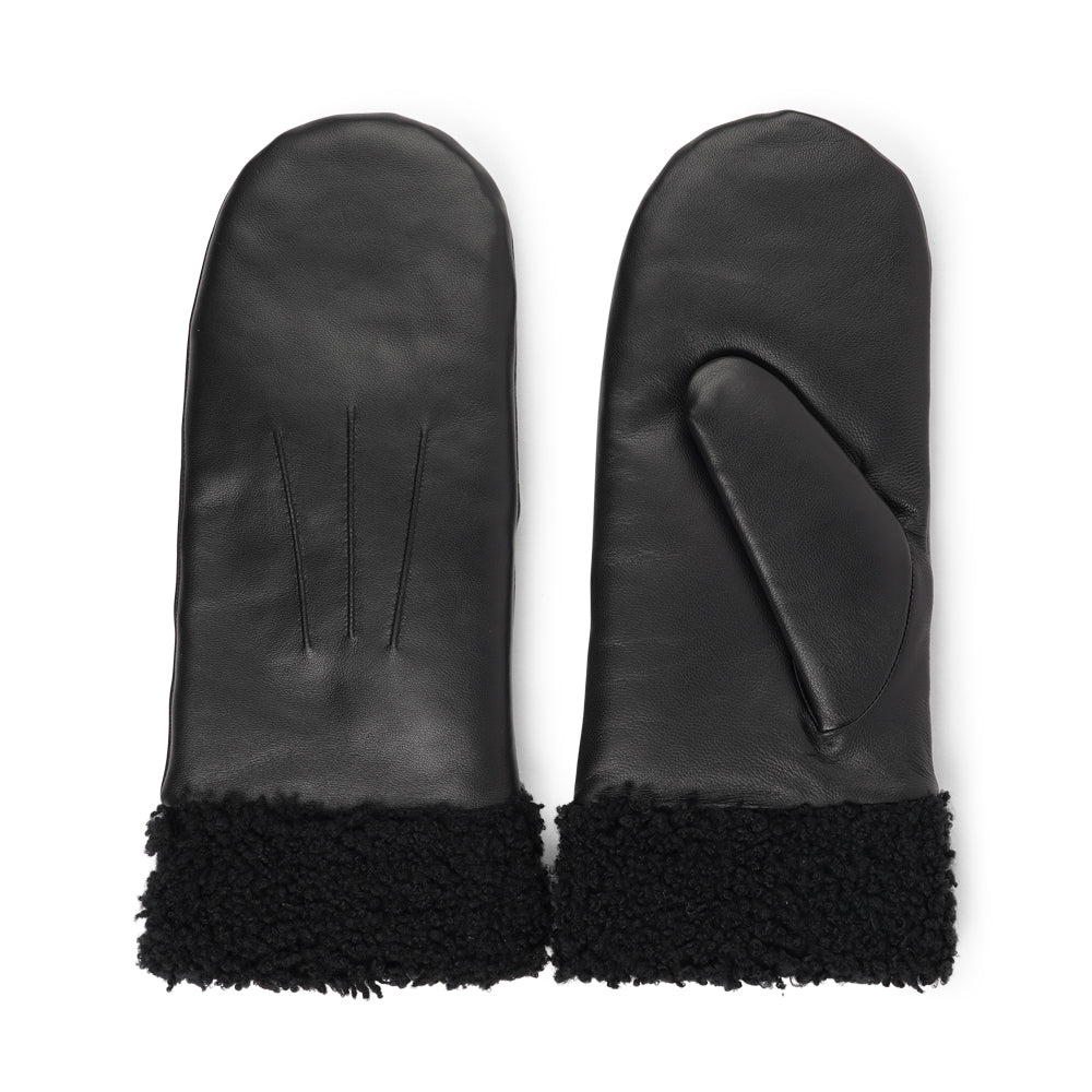 The Matera mittens are a perfect blend of elegance and warmth, crafted from premium leather and lined with soft, curly shearling.

Their feminine design offers both style and comfort, making them an ideal choice for chilly days. With a luxurious feel and timeless look, these mittens are a chic winter essential.