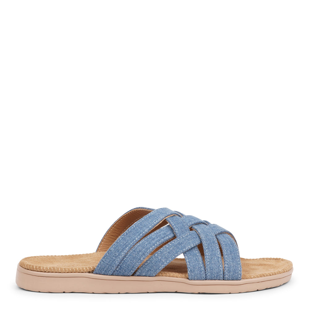 Say hello to the captivating Matara sandal, drawing inspiration from the stunning coasts of Sri Lanka.  This sandal is a luxurious treat, featuring durable rubber embraced by velvety suede. With delicate denim straps adding a playful flair, it effortlessly enhances any ensemble. It's the ultimate blend of chic and trendy style.