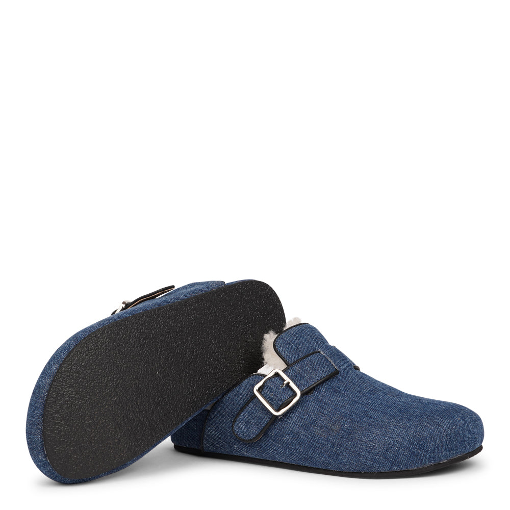 Lovelies Studio - The Nesso Denim Mules are the epitome of luxurious comfort and style. Crafted with a beautiful denim upper, these exclusive mules feature an adjustable buckle for a customized fit. Lined with soft curly shearling, they provide warmth and a cozy feel, perfect for cooler days.&nbsp;

The durable rubber sole ensures long-lasting wear and excellent traction, making them a practical yet indulgent choice. With their elegant design and plush materials, the Nesso Denim Mules effortlessly blend fun