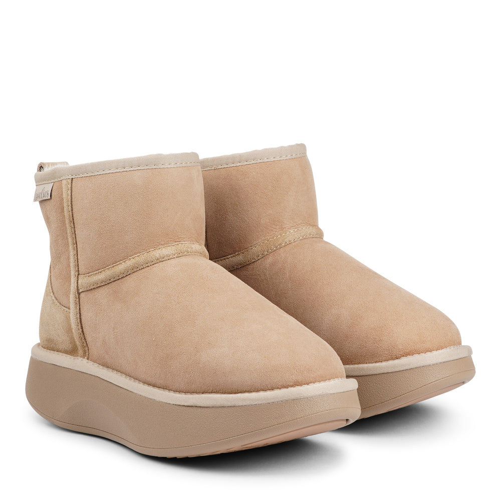 Lovelies Studio - Crafted for unparalleled comfort, these luxurious shearling boots are your perfect winter companion. With soft, durable rubber soles, they provide the confidence to navigate colder months while keeping your feet protected from the elements.

The Prayon boots go beyond mere functionality—effortlessly combining warmth and style, they offer a seamless blend of fashion and practicality.