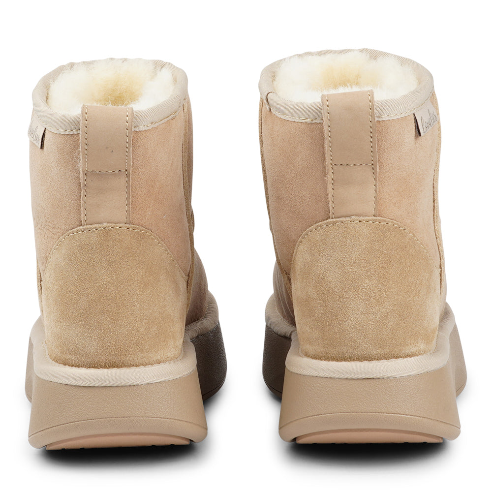 Lovelies Studio - Crafted for unparalleled comfort, these luxurious shearling boots are your perfect winter companion. With soft, durable rubber soles, they provide the confidence to navigate colder months while keeping your feet protected from the elements.

The Prayon boots go beyond mere functionality—effortlessly combining warmth and style, they offer a seamless blend of fashion and practicality.