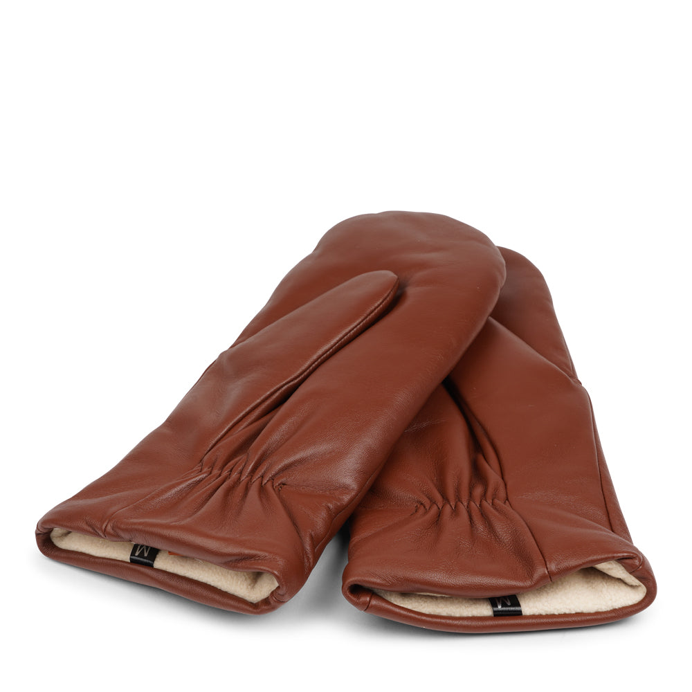 The Ravenna mittens are crafted from premium leather and feature a plush fleece lining for exceptional warmth and comfort.

With their sophisticated design and luxurious materials, these mittens offer both style and practicality, making them an essential accessory for chilly weather.