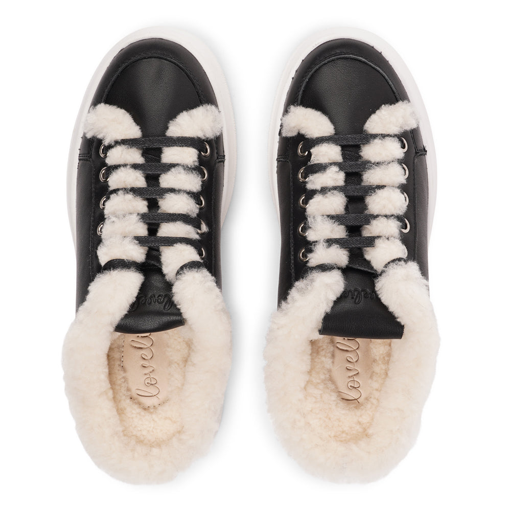 Style Selva from Lovelies. The upper is adorned with suede and features charming shearling details, adding a touch of luxury to your every step. Whether you're dressing up for a night out or aiming for a more casual look, these sneakers effortlessly elevate your style.

With a full innersole and lining of plush shearling, your feet are cocooned in comfort and warmth. This luxurious lining not only keeps you toasty but also molds around your feet, providing a custom fit like no other.