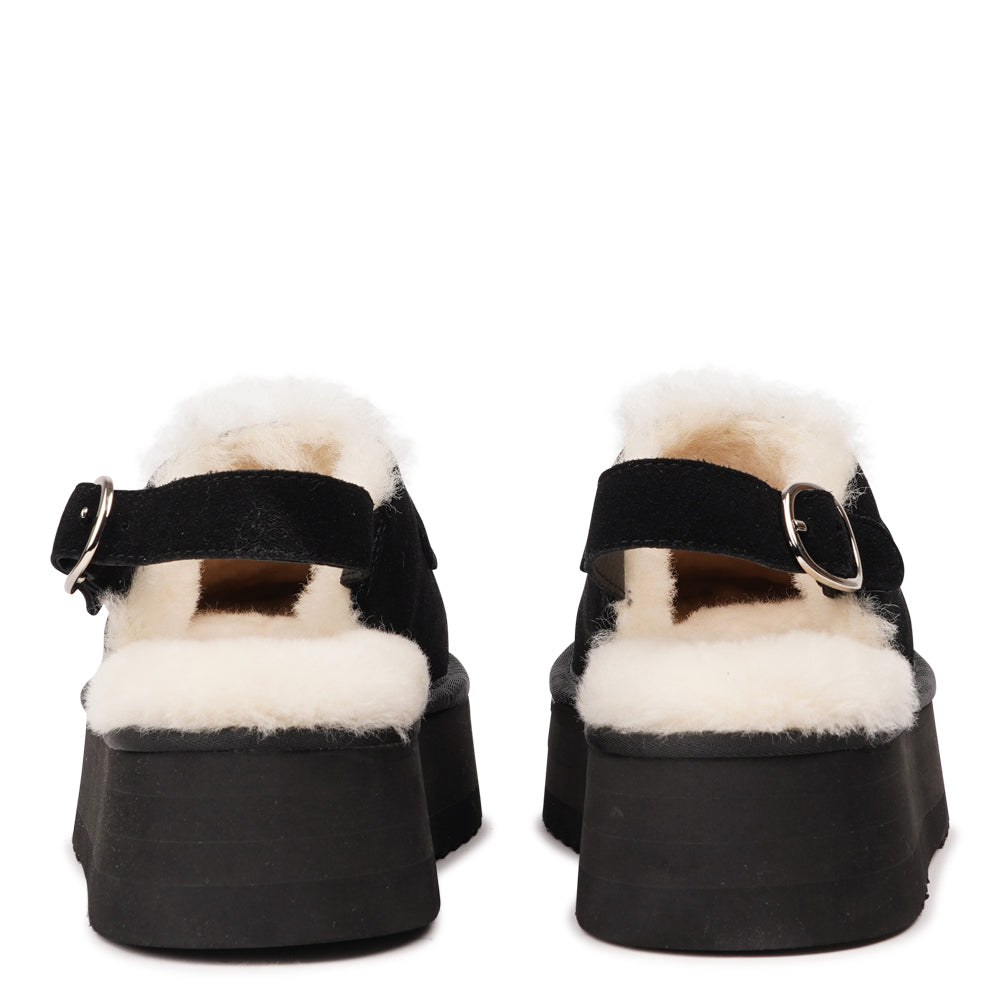 Step into a world of luxury and coziness with our Siple suede mules. Crafted with the finest suede, these mules are designed to provide not only elegance but also ultimate comfort for your feet. The sumptuous shearling lining ensures your feet stay warm and snug, making them the perfect choice for colder days.

The standout feature of the Siple mules is the adjustable heel strap, allowing you to customize the fit to your liking. This ensures a secure and comfortable feel as you walk, no matter where your da