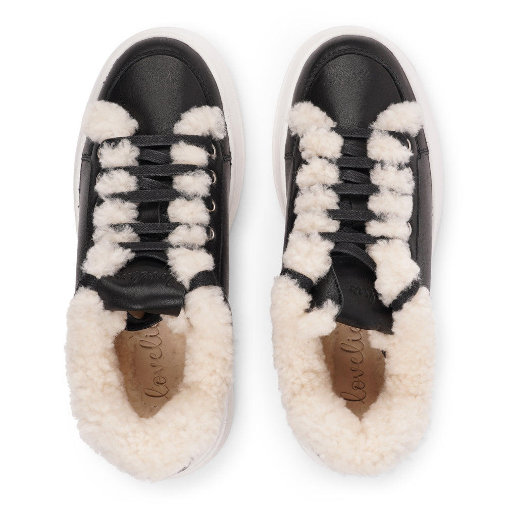 Lovelies Studio Elevate your sneaker game with the Zanja low sneaker, a true embodiment of comfort and style. Crafted to keep you not only fashion-forward but also snug and cozy.

At the foundation of the Zanja low sneaker lies a soft yet durable rubber sole, ensuring long-lasting wear and exceptional grip.

The upper is adorned with leather and features charming shearling details, adding a touch of luxury to your every step. Whether you're dressing up for a night out or aiming for a more casual look, these